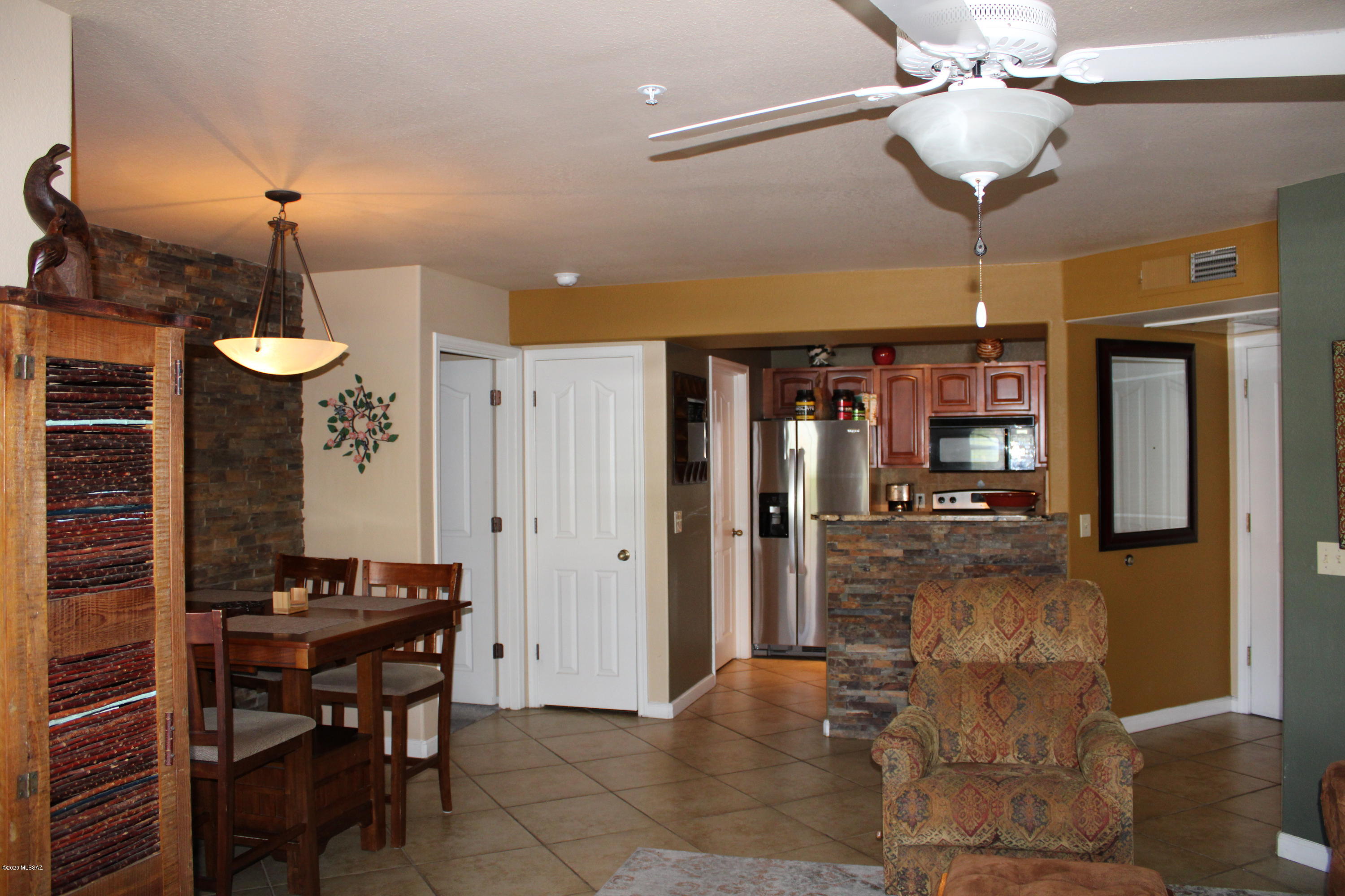 5751 North Kolb Road, Unit 36203 Tucson, AZ 85750 - Photo 11 of 25 a view of a dining room with furniture