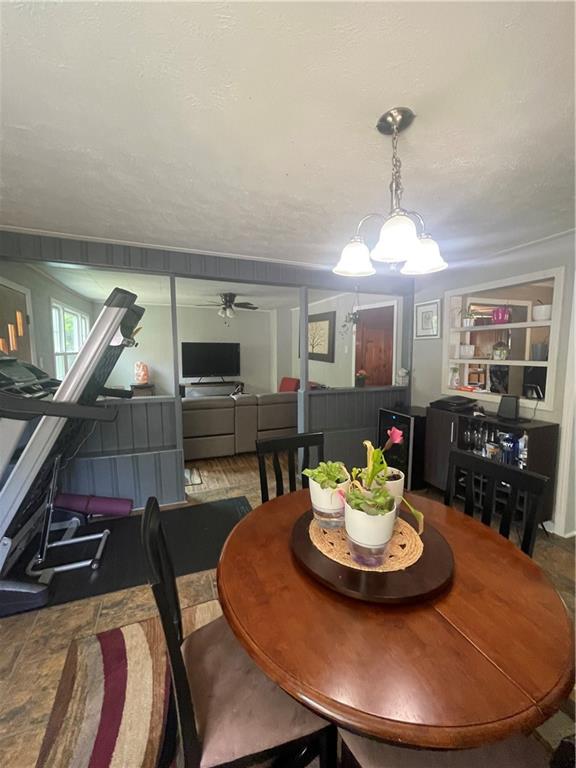 1927 Millerstown Road Tarentum, PA 15084 - Photo 12 of 23 a living room with furniture and a dining table