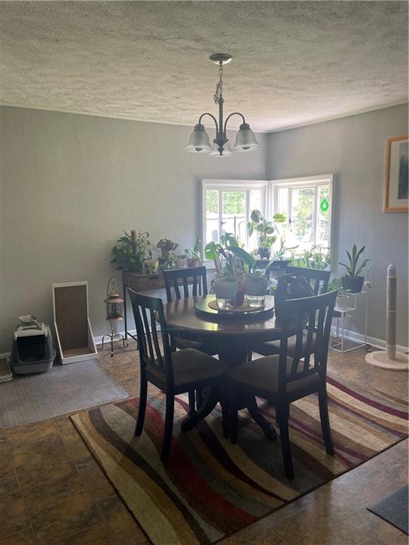1927 Millerstown Road Tarentum, PA 15084 - Photo 14 of 23 a view of a dining room with furniture window and outside view