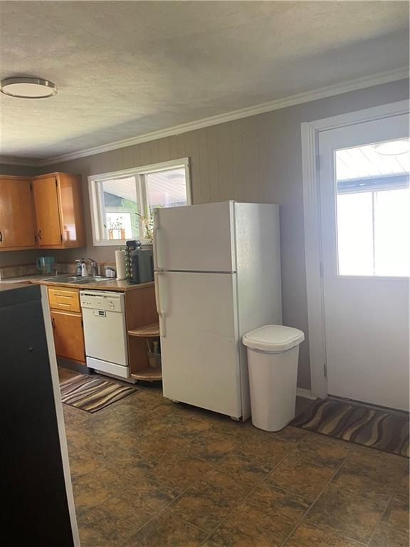 1927 Millerstown Road Tarentum, PA 15084 - Photo 8 of 23 a kitchen with a refrigerator a sink and a stove
