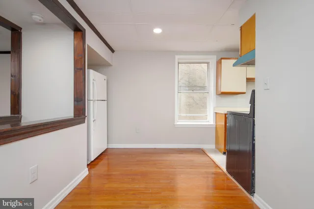 a view of an empty room with a window