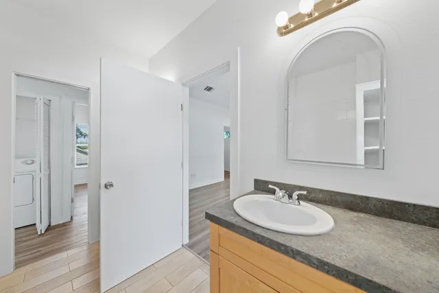 a bathroom with a sink and a mirror