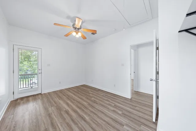 wooden floor in an empty room with a window