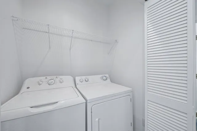 a utility room with dryer and washer