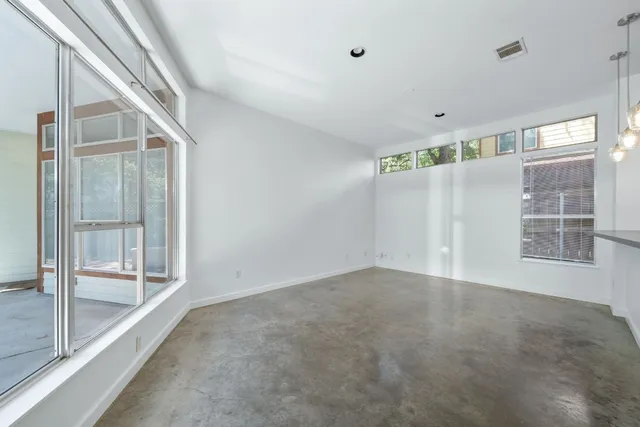 a view of empty room with windows