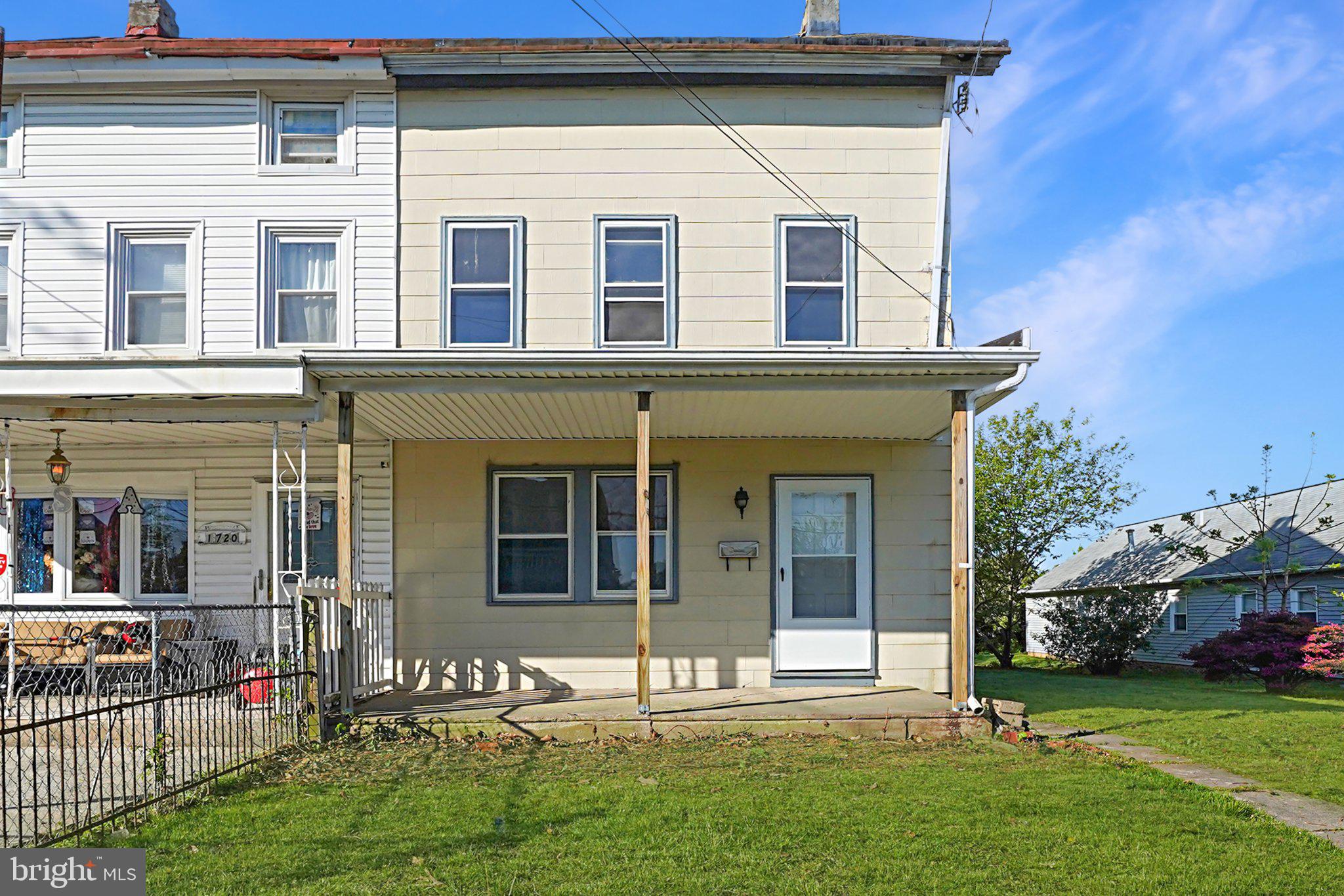 Charming duplex with inviting porch.