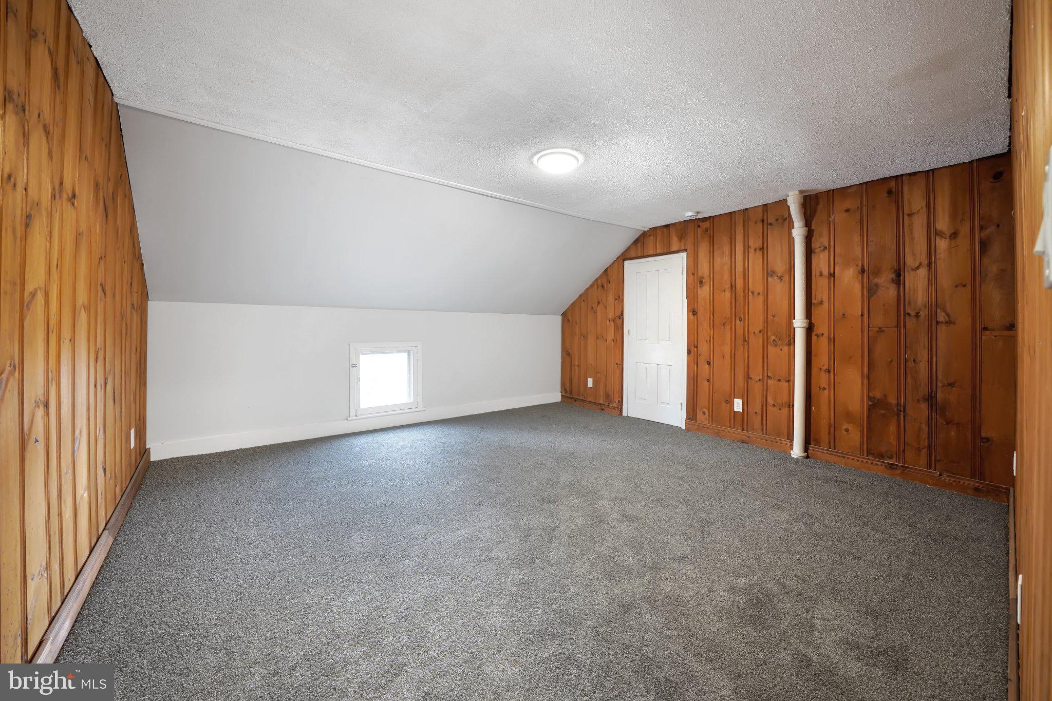 1718 Kohl Street Philadelphia, PA 19115 - Photo 26 of 34 Cozy attic space with wooden accents.