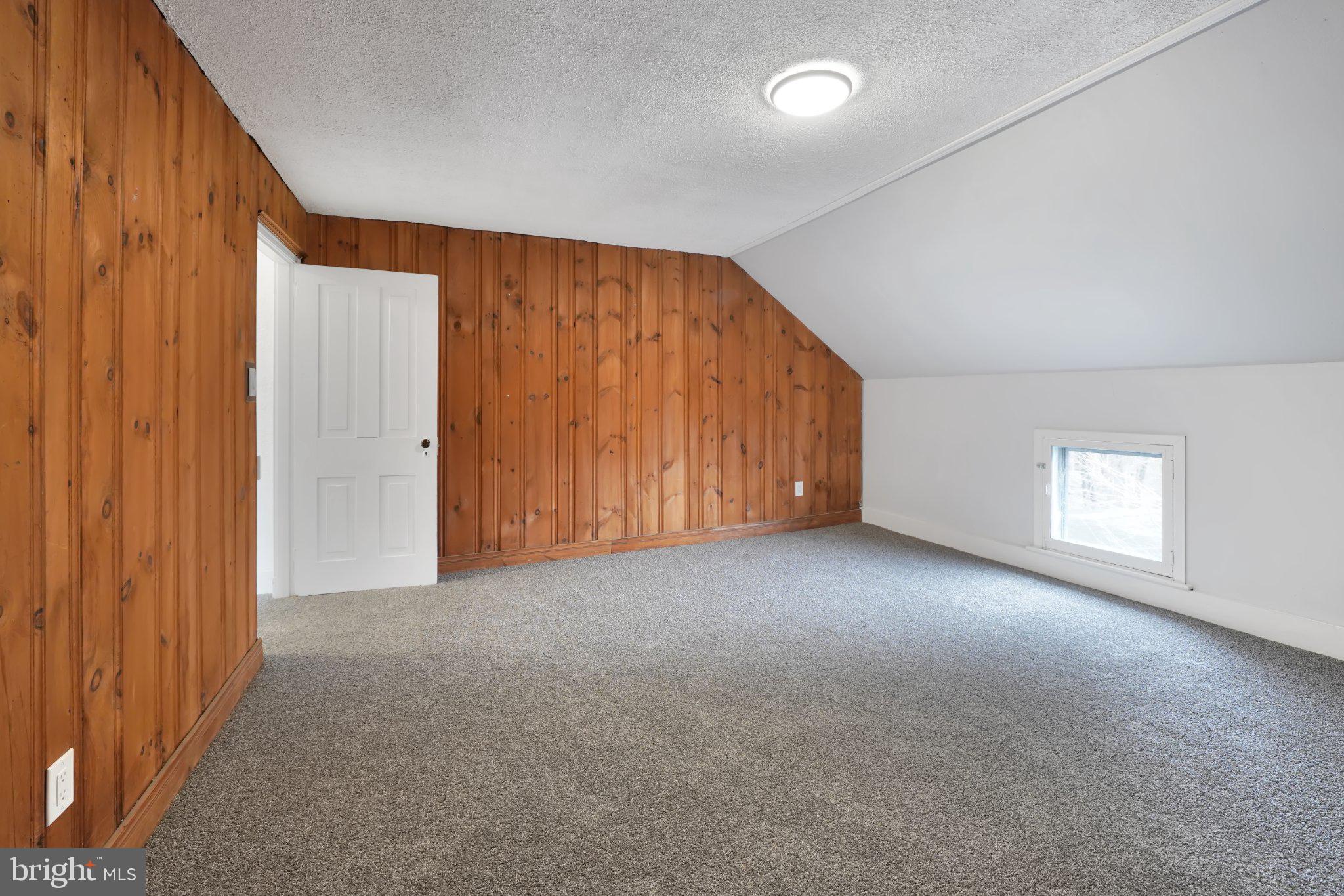 1718 Kohl Street Philadelphia, PA 19115 - Photo 28 of 34 Cozy attic space with wood accents.