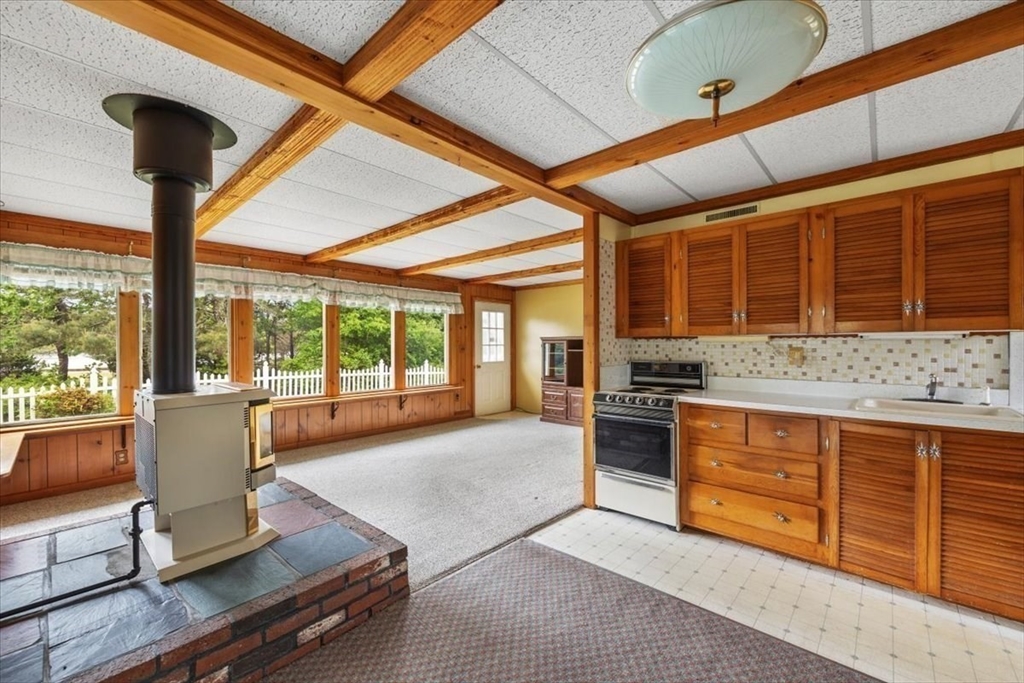 48 Canal View Road Bourne, MA 02532 - Photo 3 of 35 a open kitchen with granite countertop a stove and cabinets