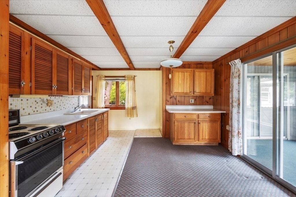 48 Canal View Road Bourne, MA 02532 - Photo 5 of 35 a kitchen with stainless steel appliances granite countertop a stove a sink and a refrigerator
