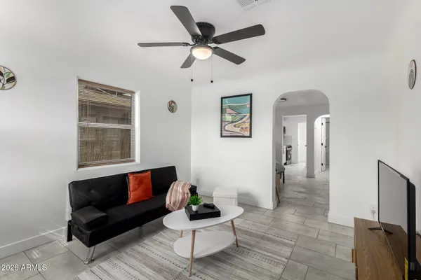 a living room with furniture and a window