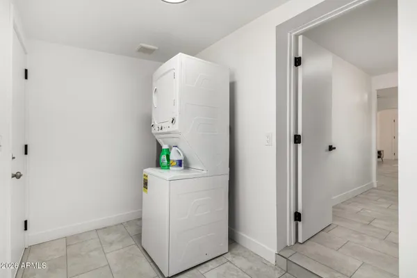 a room with a cabinets and a sink