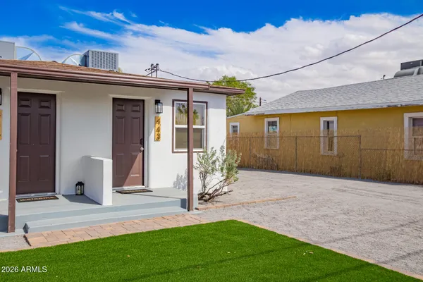 a view of a house with a yard