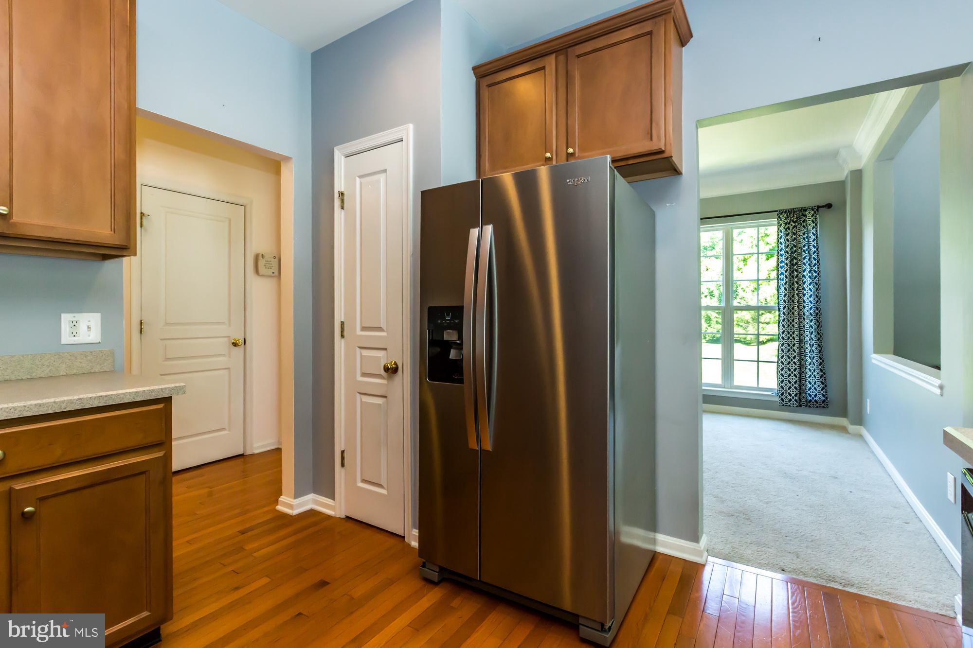 684 Churchill Road Chester Springs, PA 19425 - Photo 19 of 54 a view of kitchen with stainless steel appliances wooden floor and cabinets