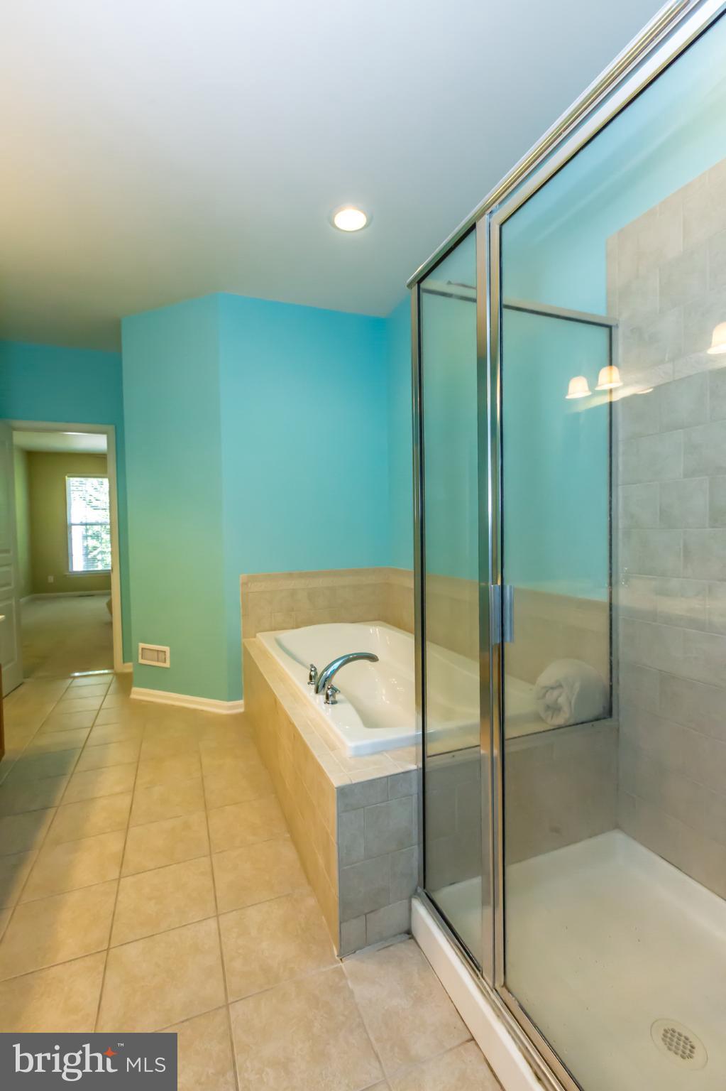 684 Churchill Road Chester Springs, PA 19425 - Photo 28 of 54 a bathroom with a bathtub and shower