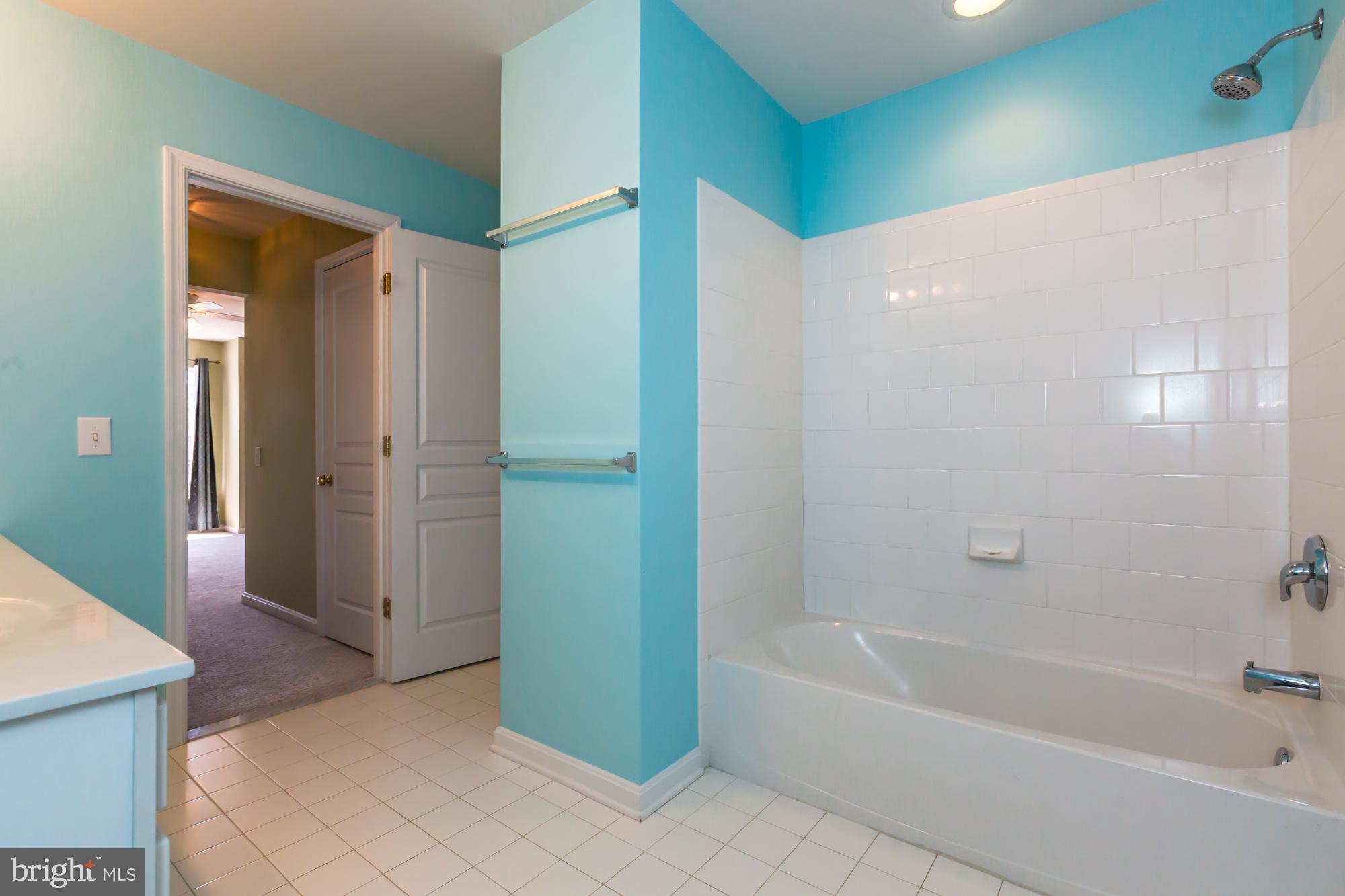 684 Churchill Road Chester Springs, PA 19425 - Photo 35 of 54 a bathroom with a bathtub and a shower