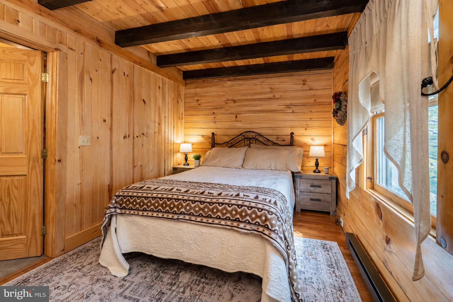 4502 Hileman Road Bruceton Mills, WV 26525 - Photo 22 of 62 a bedroom with a bed and a window