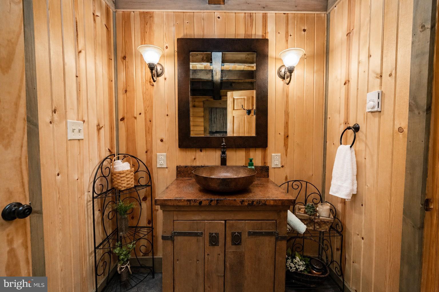 4502 Hileman Road Bruceton Mills, WV 26525 - Photo 26 of 62 a bathroom with a sink and a mirror