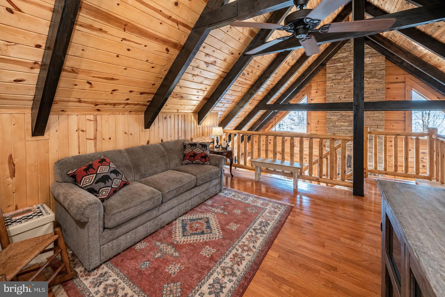 4502 Hileman Road Bruceton Mills, WV 26525 - Photo 32 of 62 a living room with furniture and a floor to ceiling window