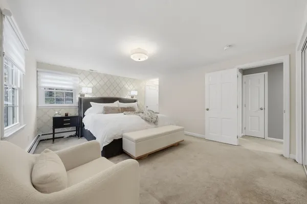 a bed room with furniture and a night stand