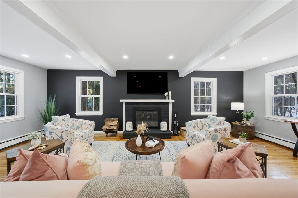 40 Curtis Road Boxford, MA 01921 - Photo 2 of 34 a living room with furniture and a fireplace