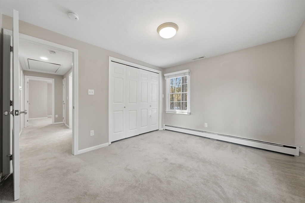 40 Curtis Road Boxford, MA 01921 - Photo 24 of 34 an empty room with windows and closet