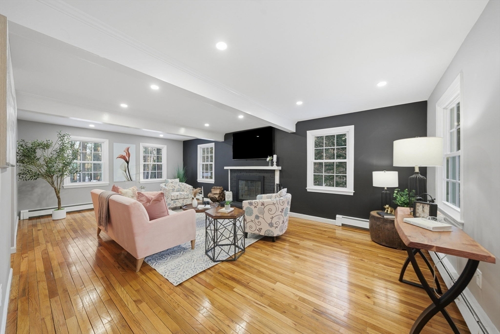 40 Curtis Road Boxford, MA 01921 - Photo 3 of 34 a living room with fireplace furniture and a flat screen tv