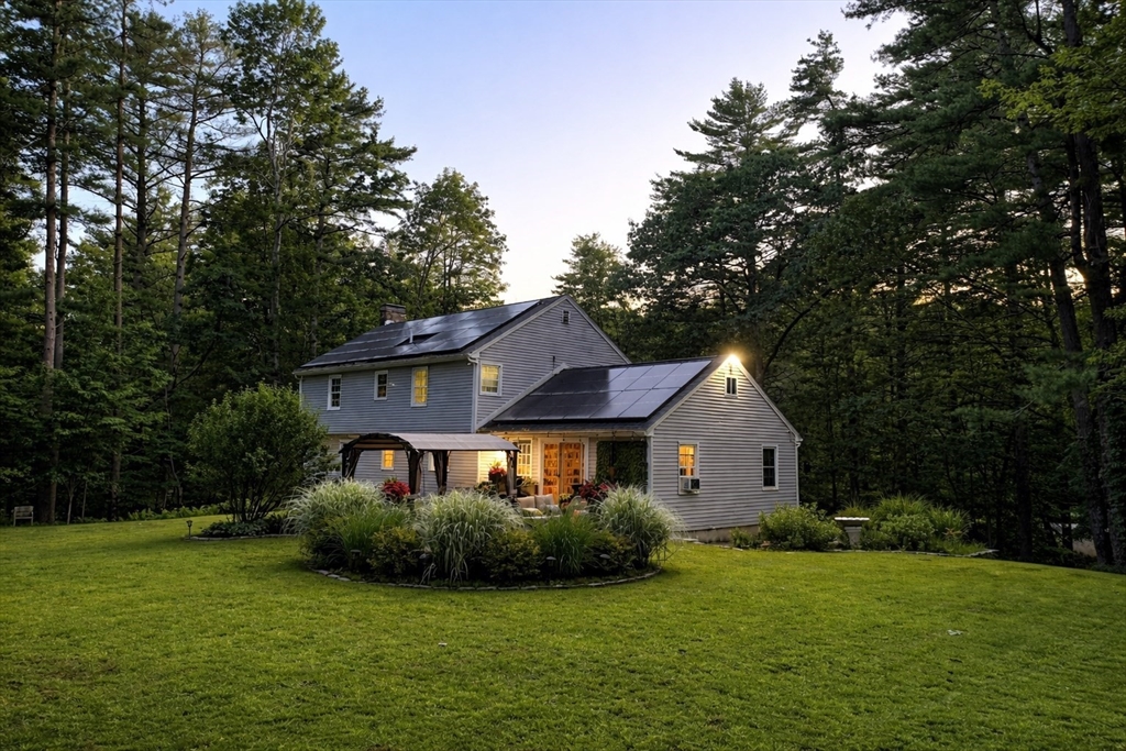40 Curtis Road Boxford, MA 01921 - Photo 33 of 34 a front view of a house with a garden
