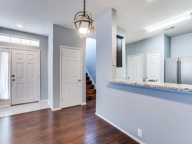 a view of cabinets and wooden floor