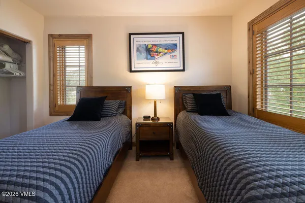 a view of a chairs and table in a balcony
