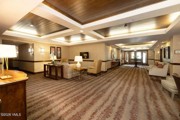 a living room with furniture and a rug