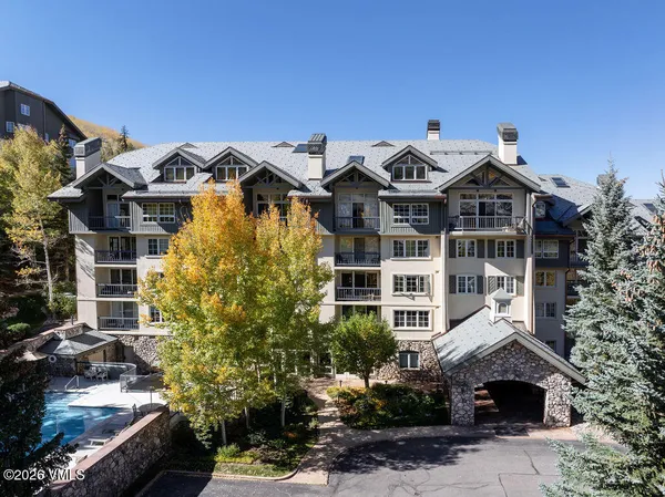 a balcony with couple of plants and flowers