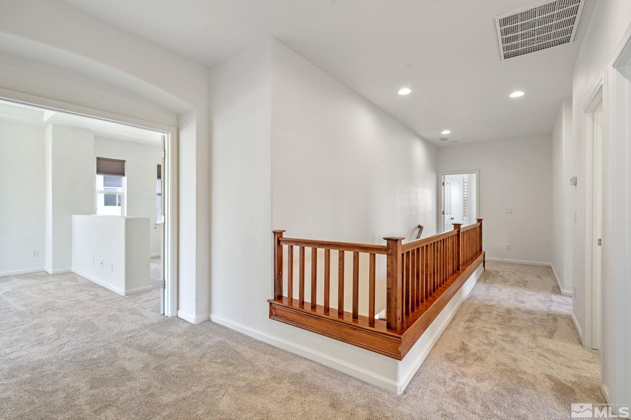 485 Teramo Court Reno, NV 89521 - Photo 17 of 37 an entryway with hallway and a chandelier fan