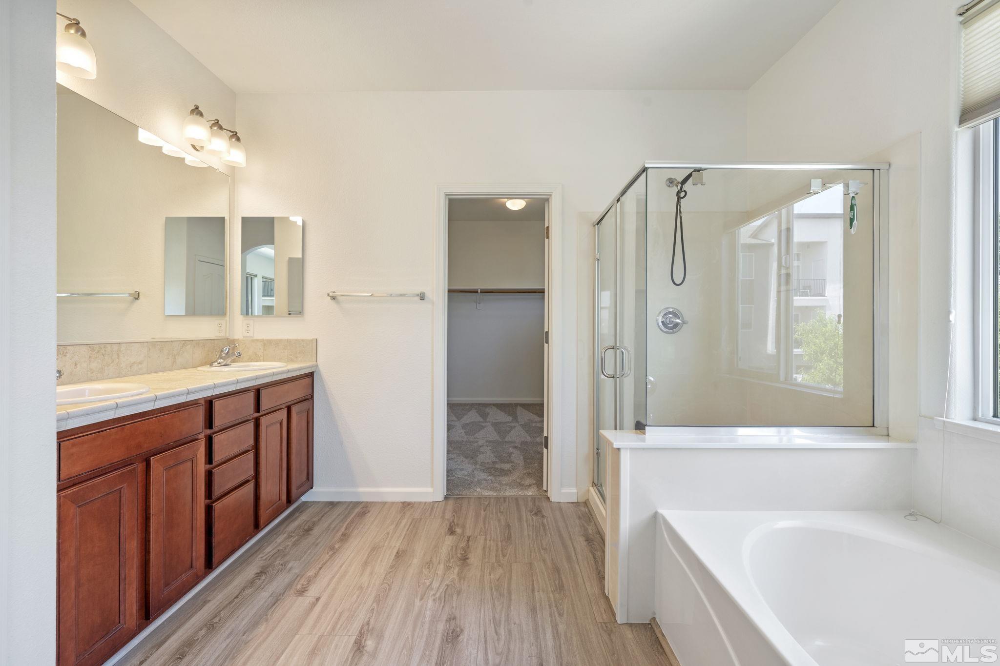 485 Teramo Court Reno, NV 89521 - Photo 23 of 37 a bathroom with a sink a mirror and a bathtub