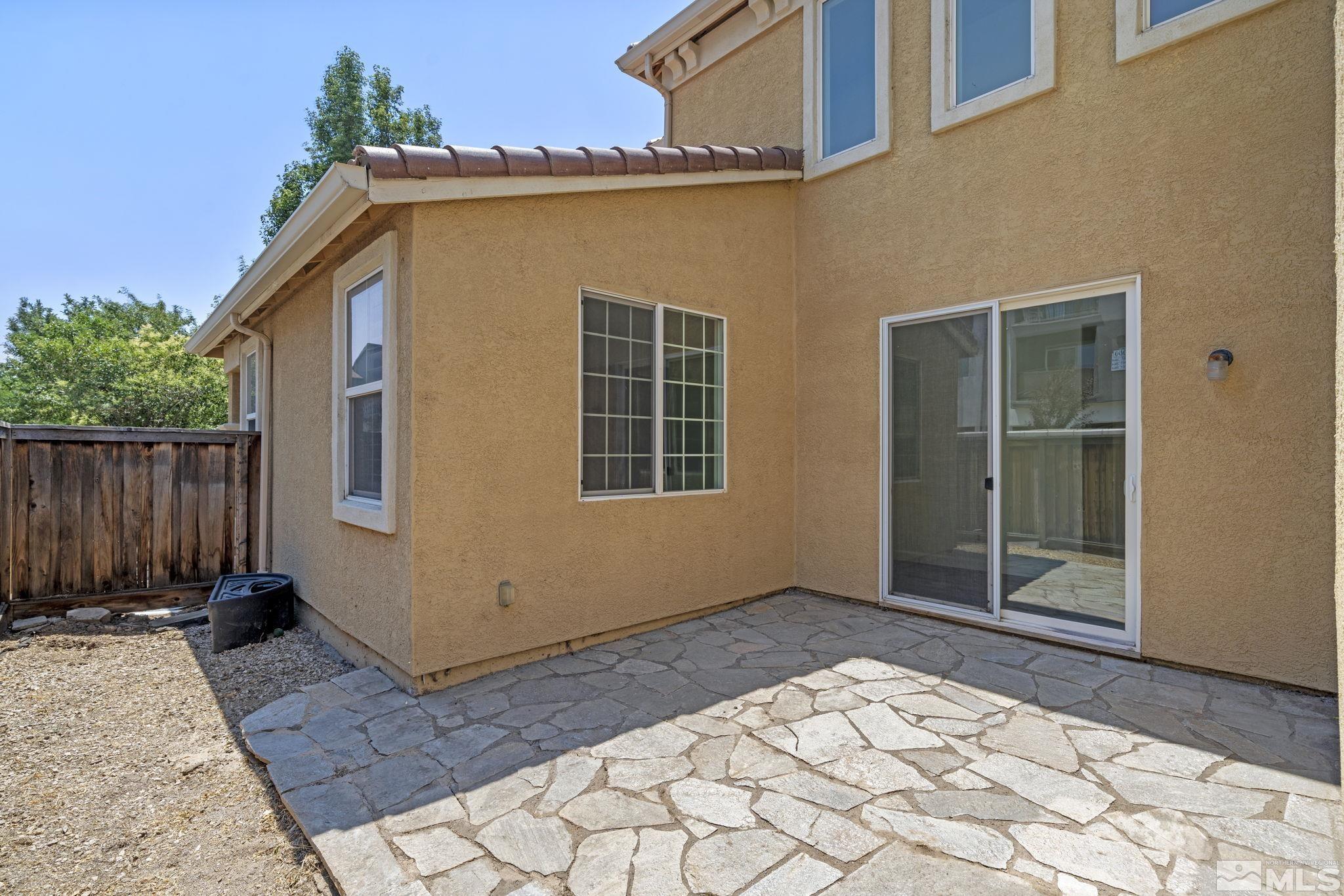 485 Teramo Court Reno, NV 89521 - Photo 36 of 37 a view of house with backyard and wooden fence