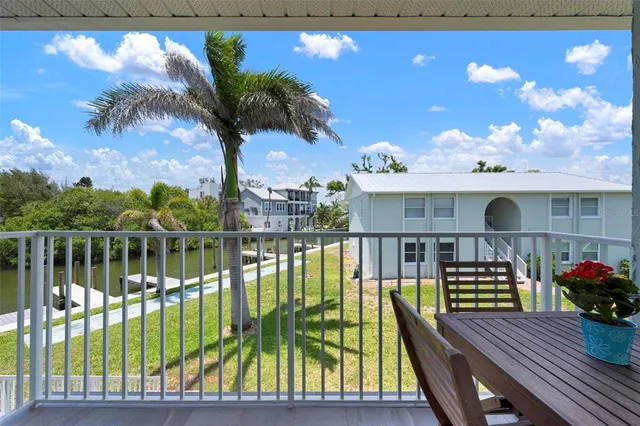 a view of balcony with furniture