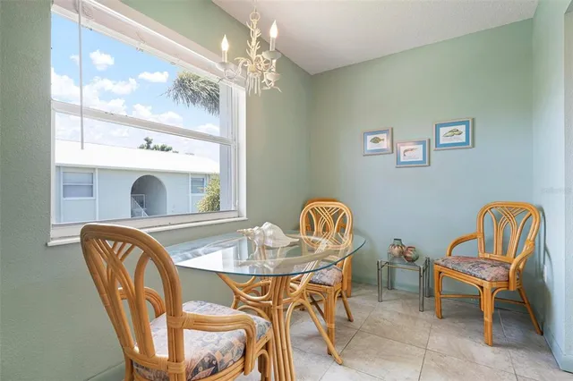 a dining room with furniture and chandelier