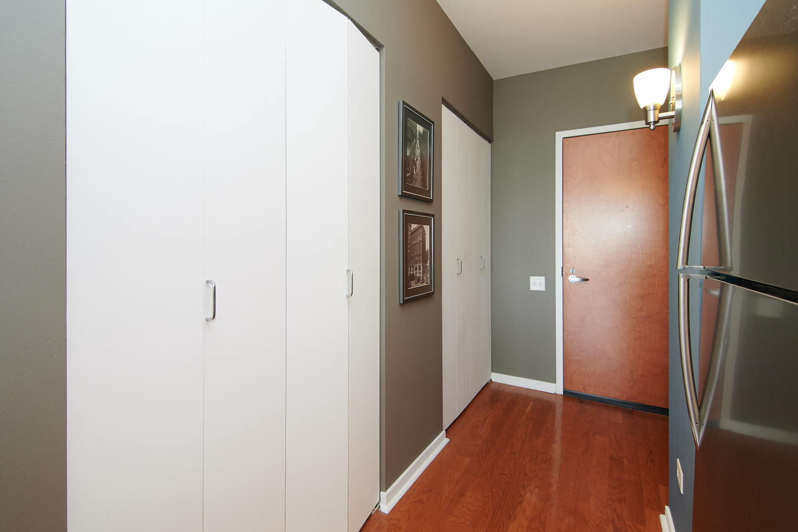 210 South Desplaines Street, Unit 1003 Chicago, IL 60661 - Photo 24 of 27 a view of hallway with wooden floor