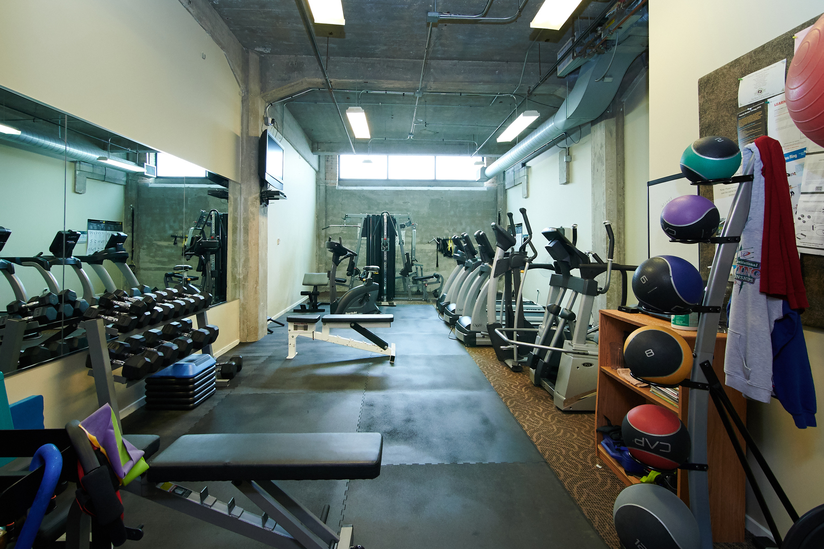 210 South Desplaines Street, Unit 1003 Chicago, IL 60661 - Photo 25 of 27 a room with lots of chairs and toys