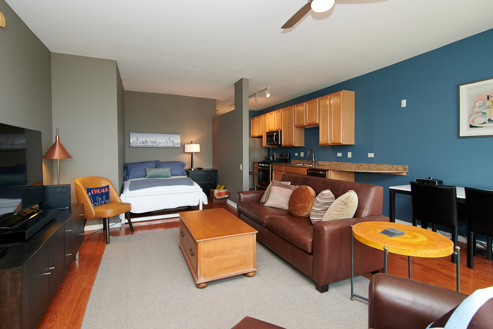 210 South Desplaines Street, Unit 1003 Chicago, IL 60661 - Photo 5 of 27 a living room with furniture and a flat screen tv