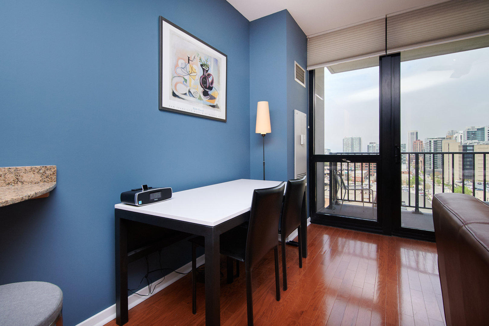 210 South Desplaines Street, Unit 1003 Chicago, IL 60661 - Photo 8 of 27 a view of a workspace with furniture and a window