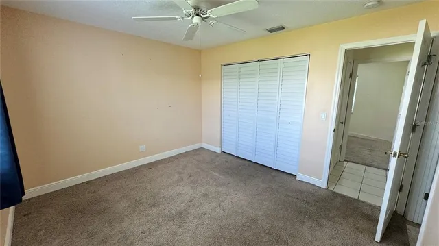 an empty room with fan