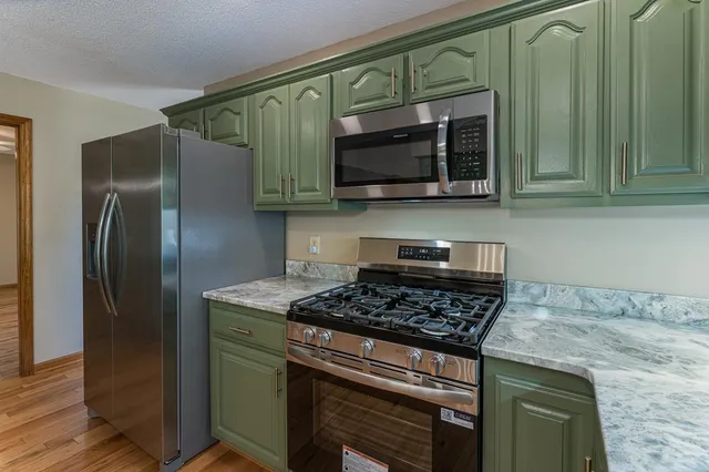 a bathroom that has a glass shower door