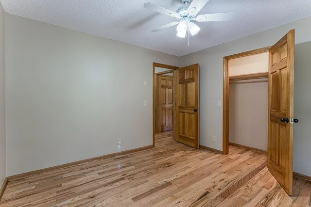 a view of an empty room with empty shelves