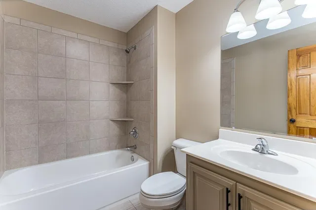 a big yard with lots of green space and trees