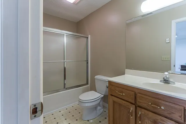 a view of a park with large trees