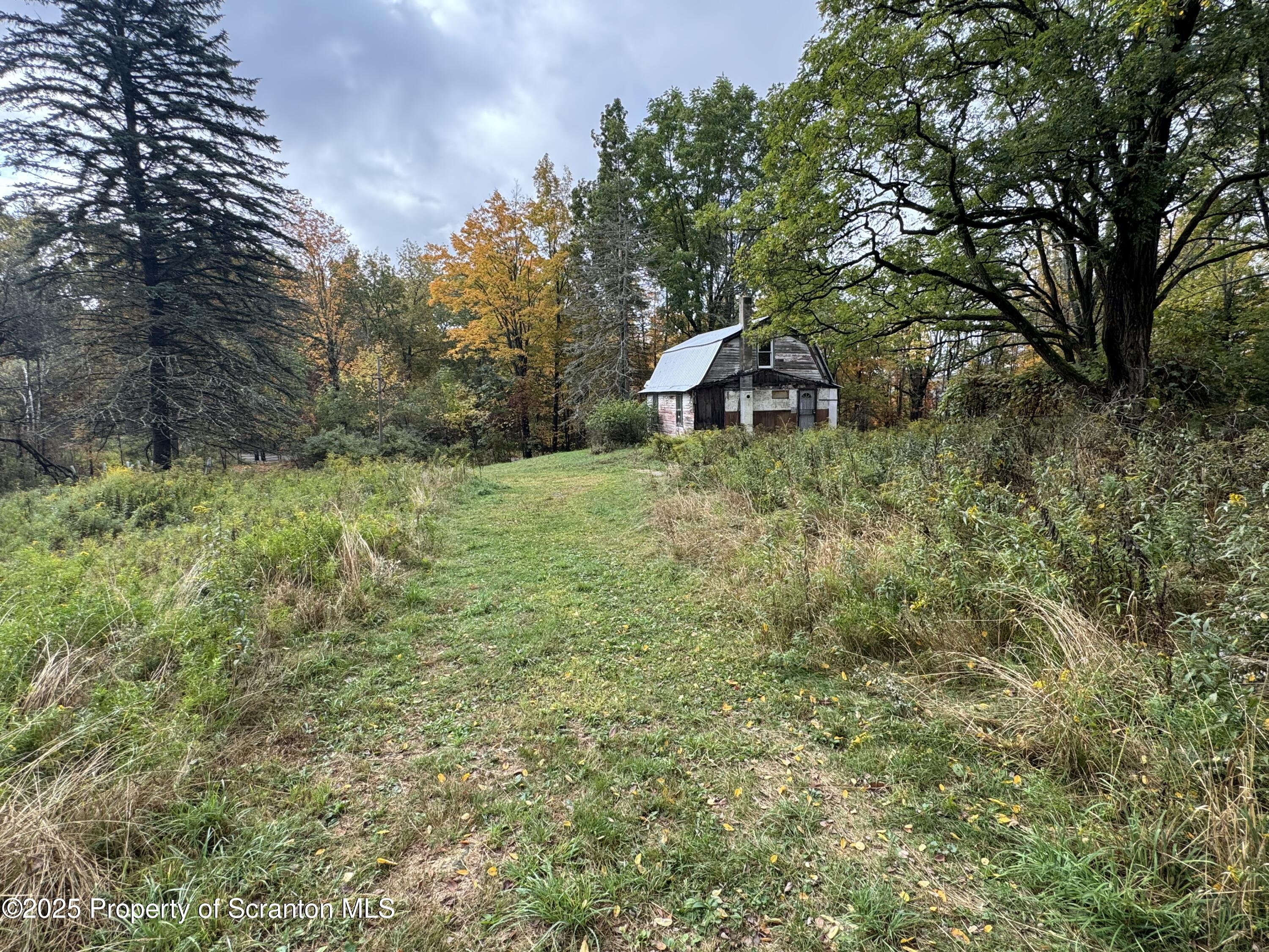 636 Darrow Road New Milford, PA 18834 - Photo 10 of 25 a view of a tiny house with a yard
