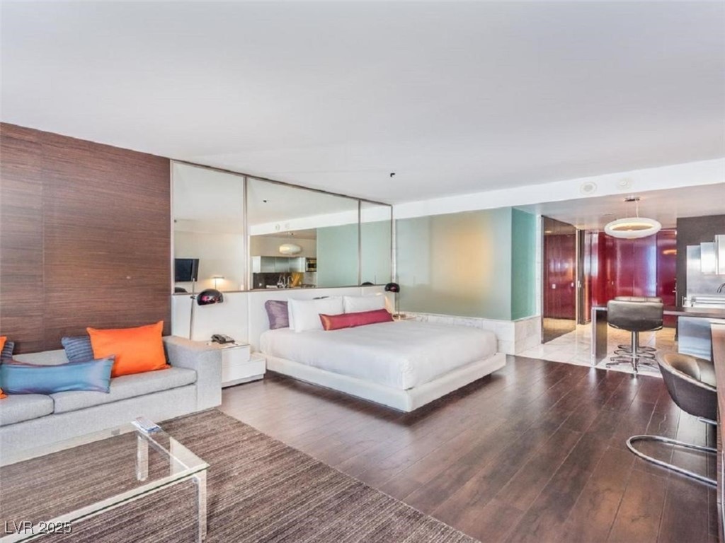 4381 West Flamingo Road, Unit 8304 Las Vegas, NV 89103 - Photo 5 of 13 Bedroom with wood finished floors