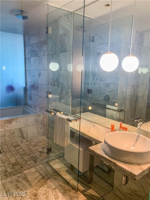 4381 West Flamingo Road, Unit 8304 Las Vegas, NV 89103 - Photo 6 of 13 Bathroom featuring a shower stall and tiled bath