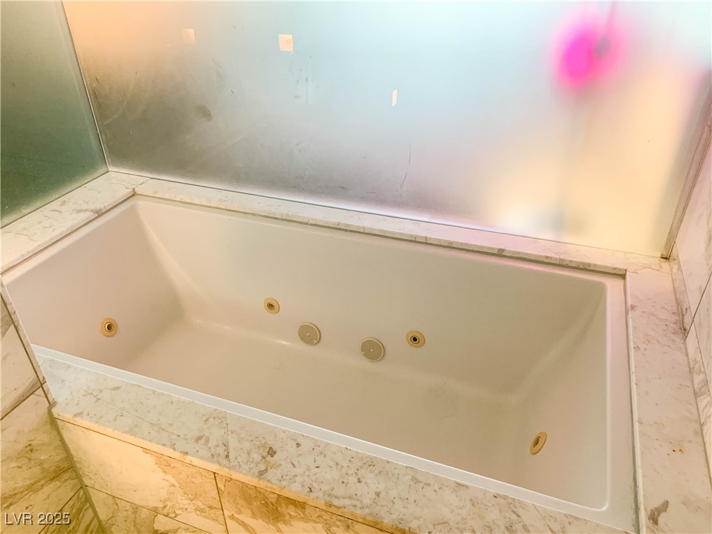 4381 West Flamingo Road, Unit 8304 Las Vegas, NV 89103 - Photo 7 of 13 Full bathroom with a jetted tub